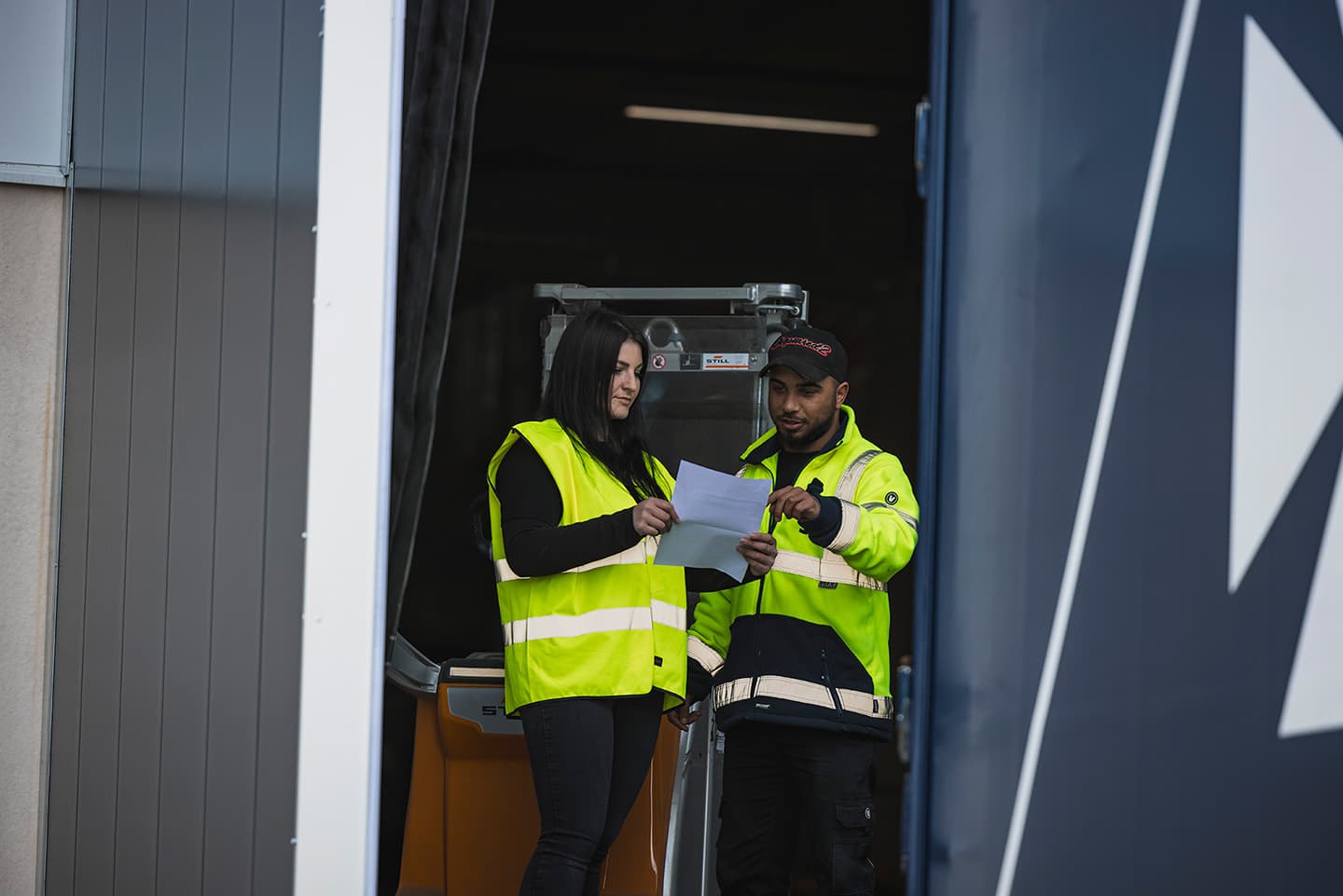 DFDS workers holding paper