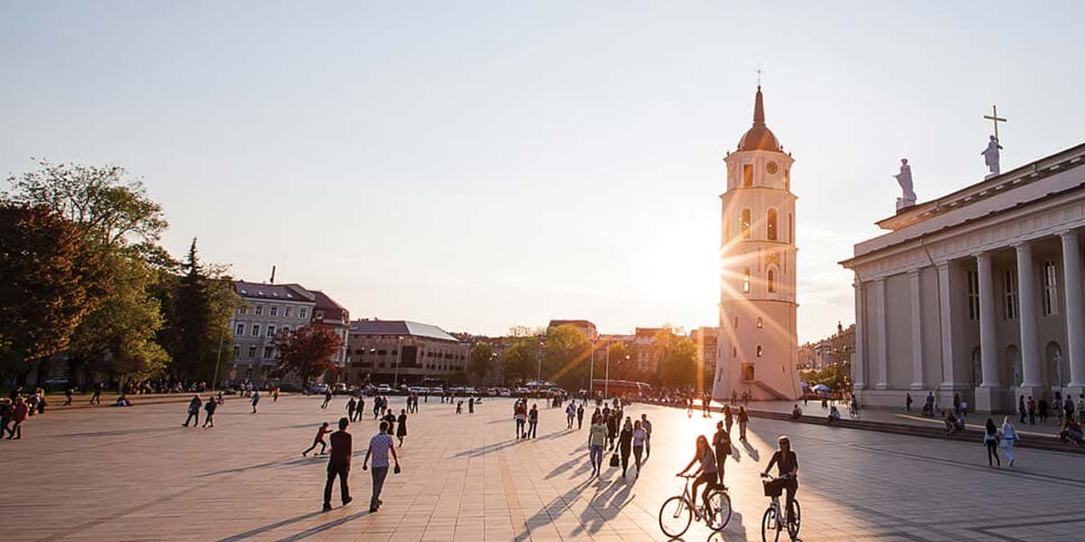 People walking through large open space in Vilnius