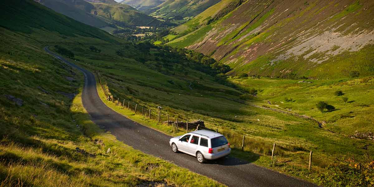 Car driving through Welsh hills