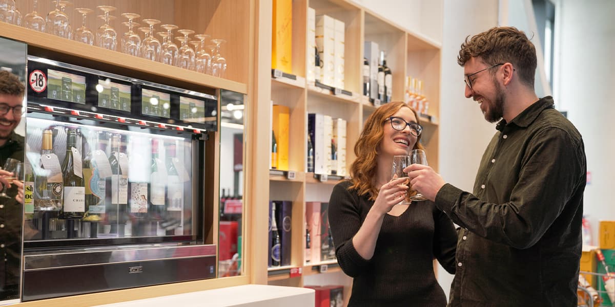 Couple tasting wine in the DFDS Duty Free shop