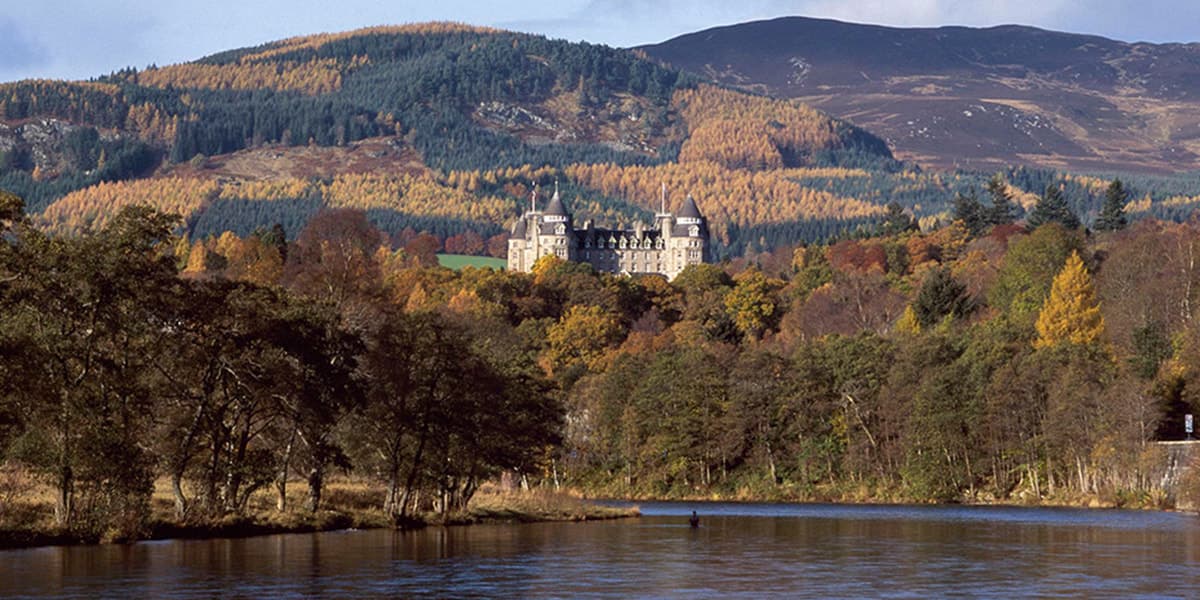 Castle in Scotland by lake and nature