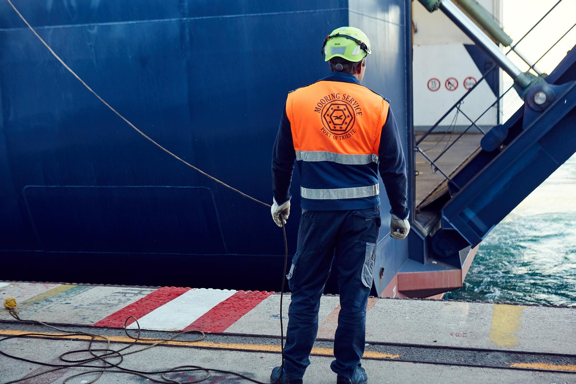 A man waiting for the bow door to open at the port in Trieste