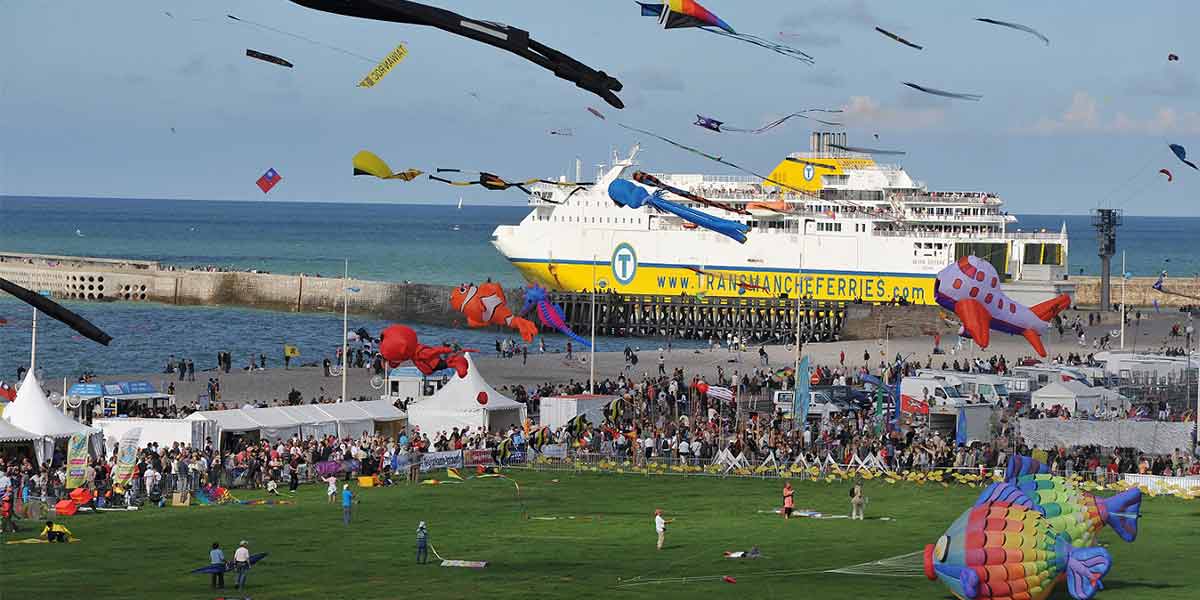 Kites in the sky with the DFDS Newhaven-Dieppe ferry in the background