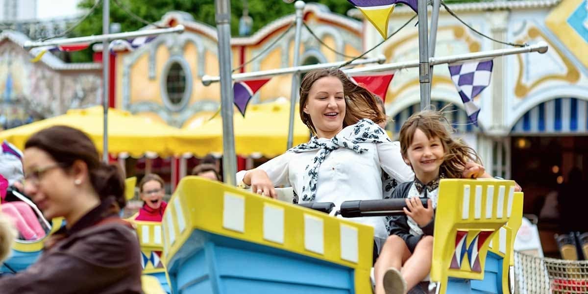 Woman and child enjoying a ride at Hansa Park