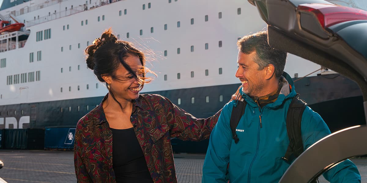 Family with DFDS ship on the background