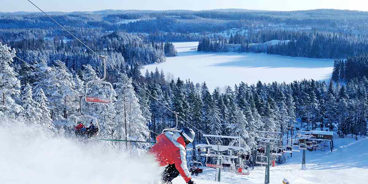 Person heading down a ski slope in Sweden
