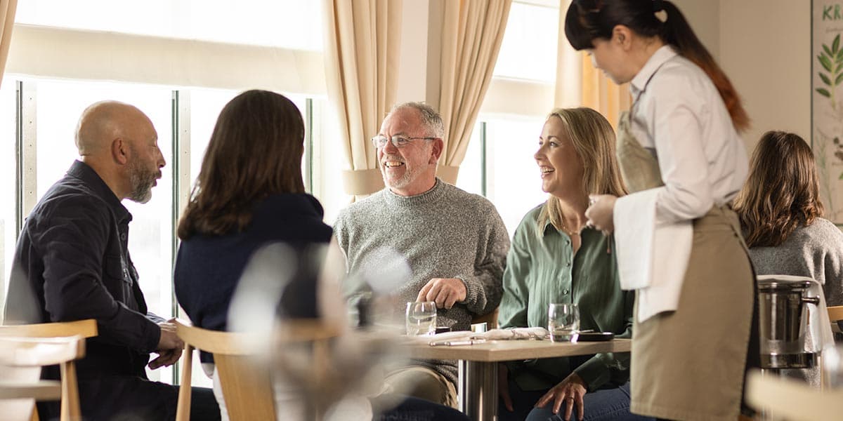 Friends enjoying a meal in Explorer restaurant