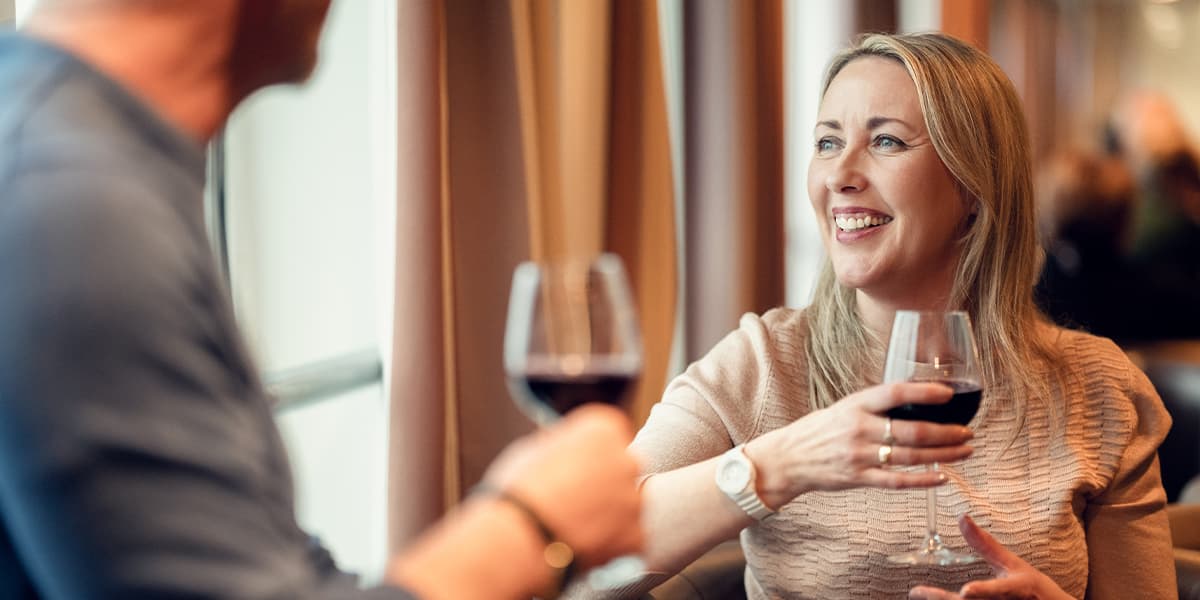 Couple drinking in navigators pub onboard DFDS ferry