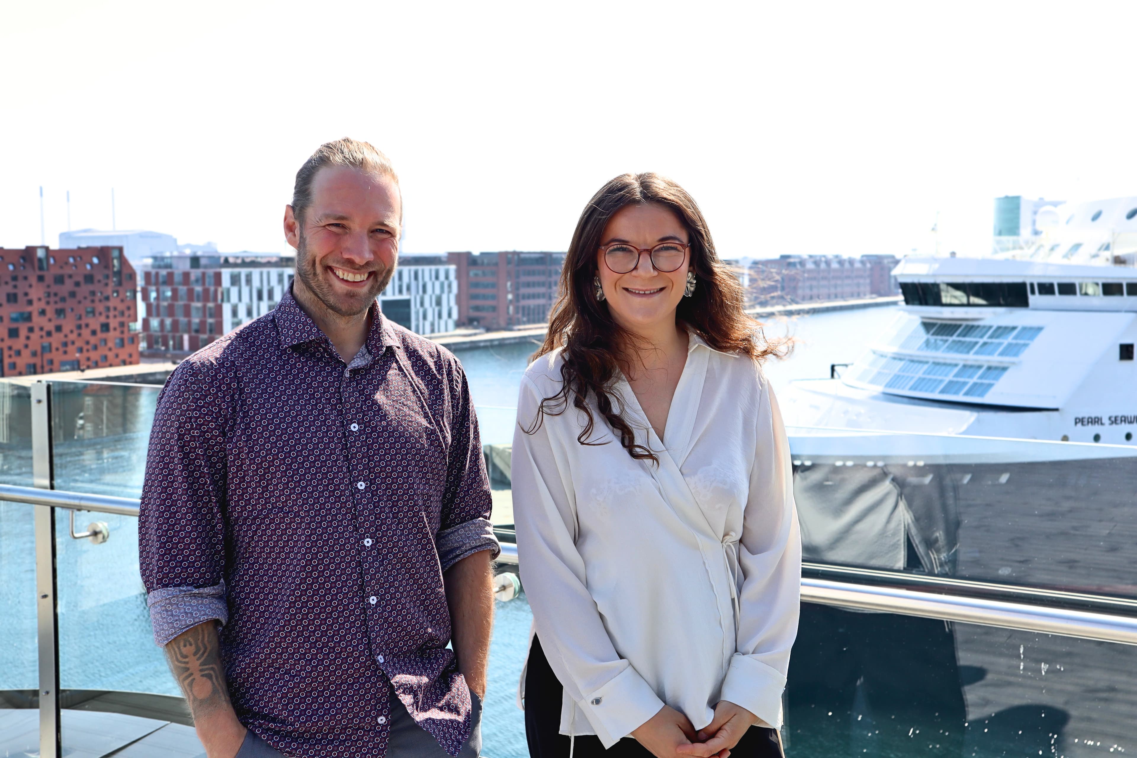 PhD candidate Nanna Thit & Mads Bentzen Billesø, Head of Innovation & Partnerships, DFDS A/S. With on the background one of the ships of the Copenhagen to Oslo route.