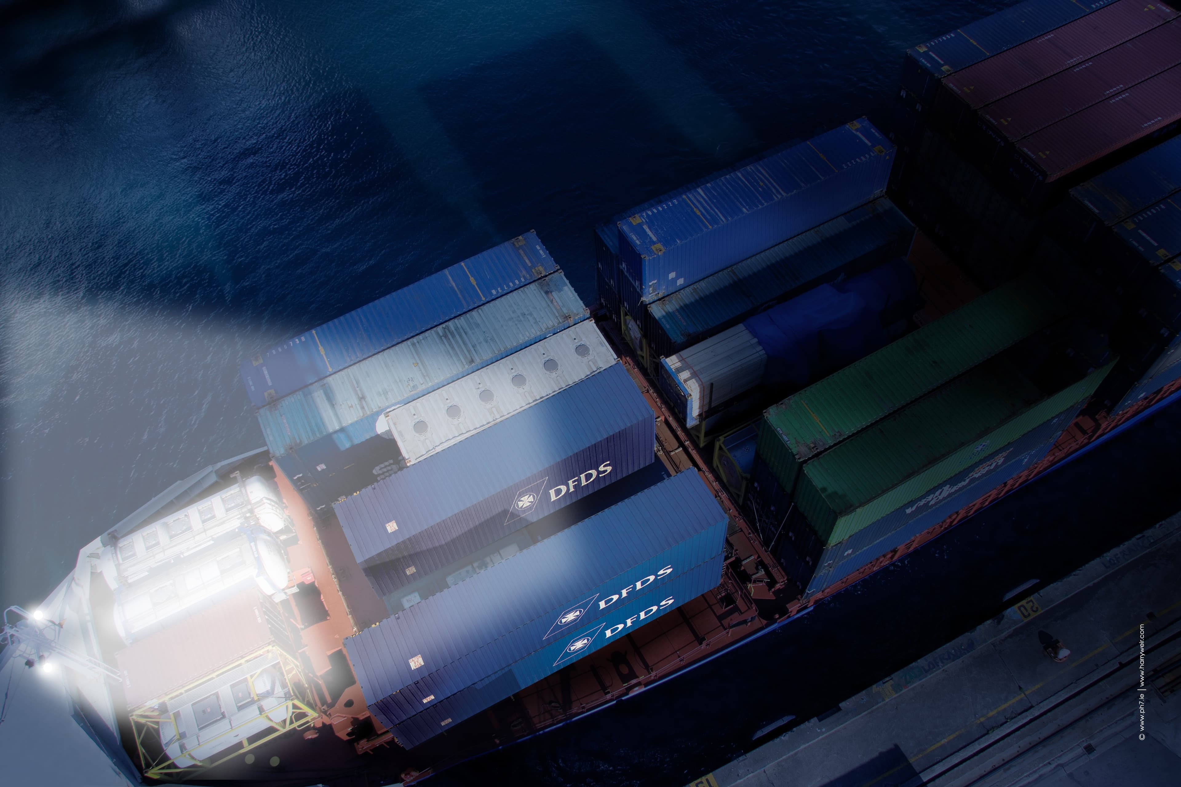 Overhead view of a DFDS ship with DFDS Logistics trucks on the top deck