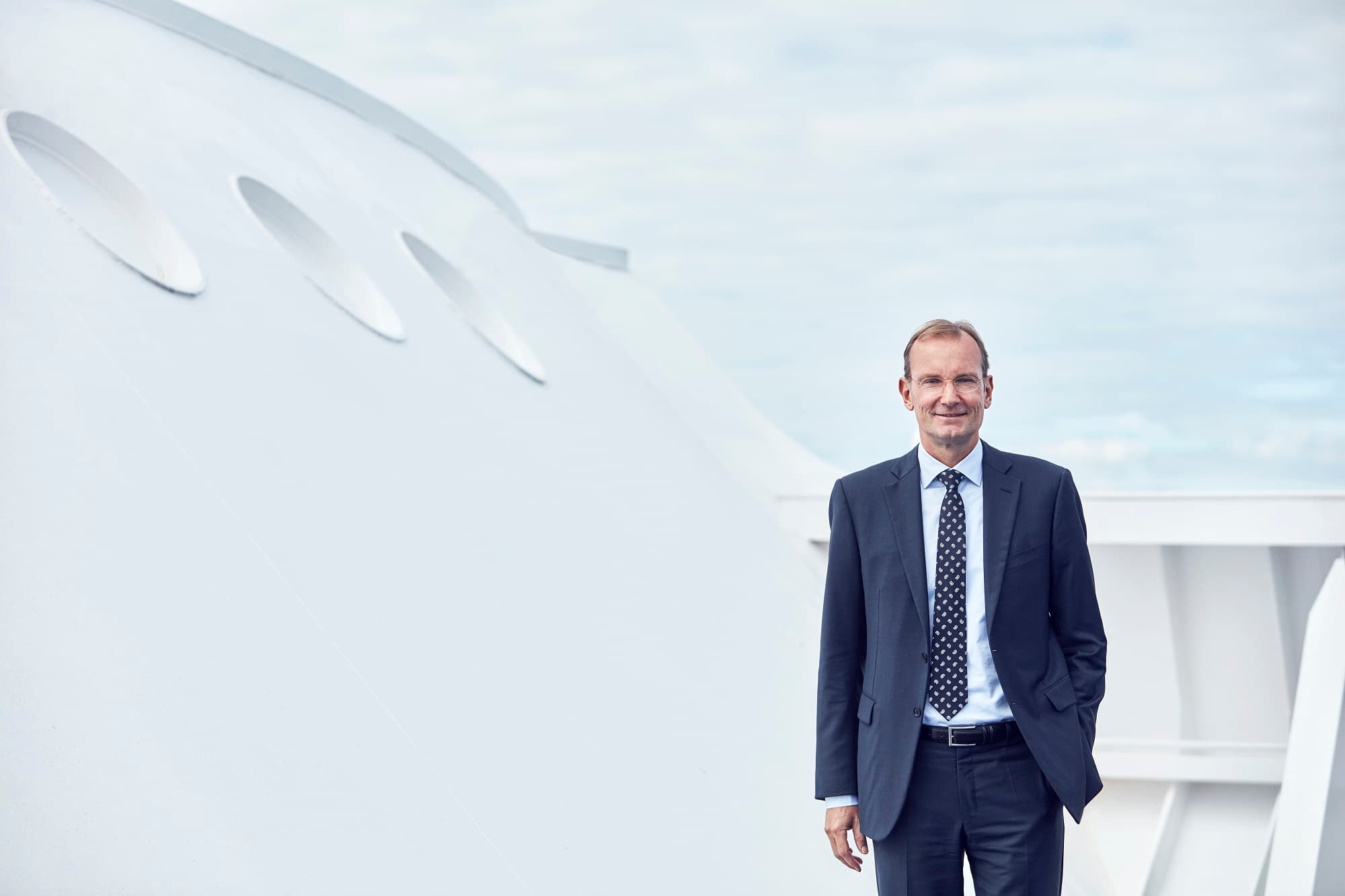 DFDS CEO Niels Smedegaard standing on the top deck of a DFDS vessel