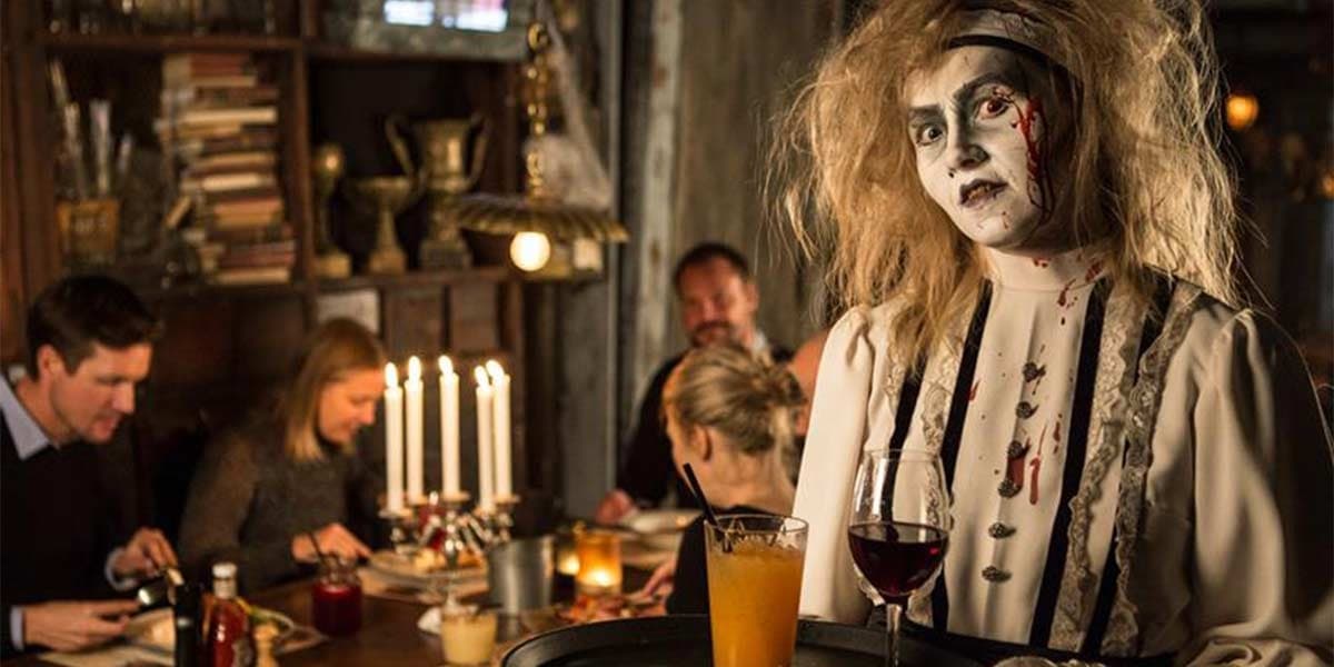Spooky costume serving food and drinks during Halloween in Gothenburg