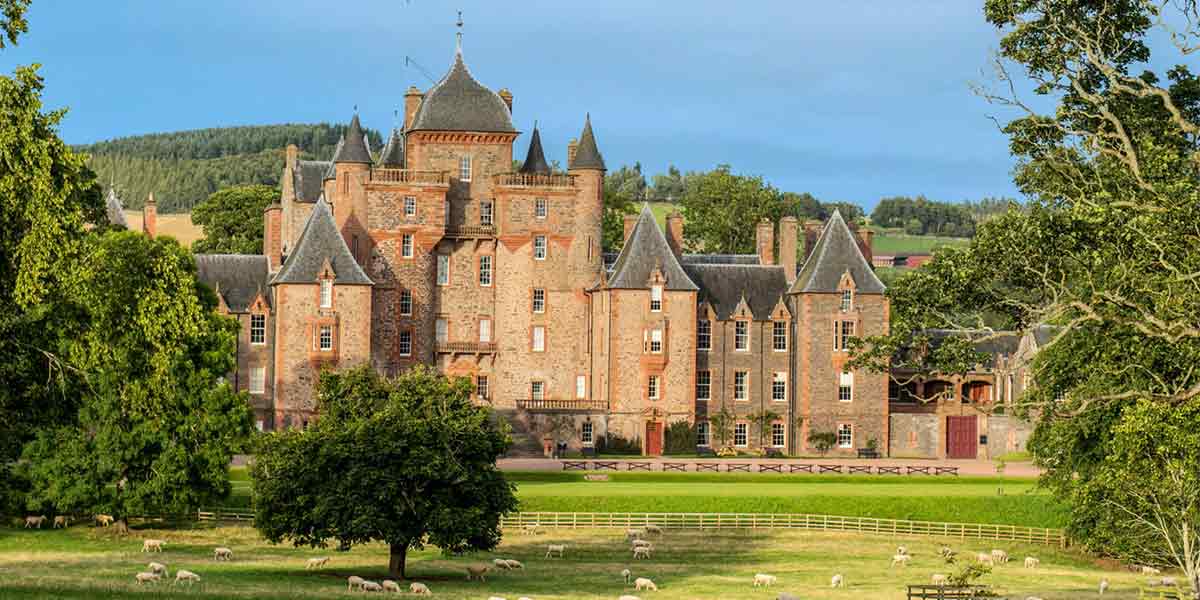 Beautiful Castle surrounded by green nature in Scotland
