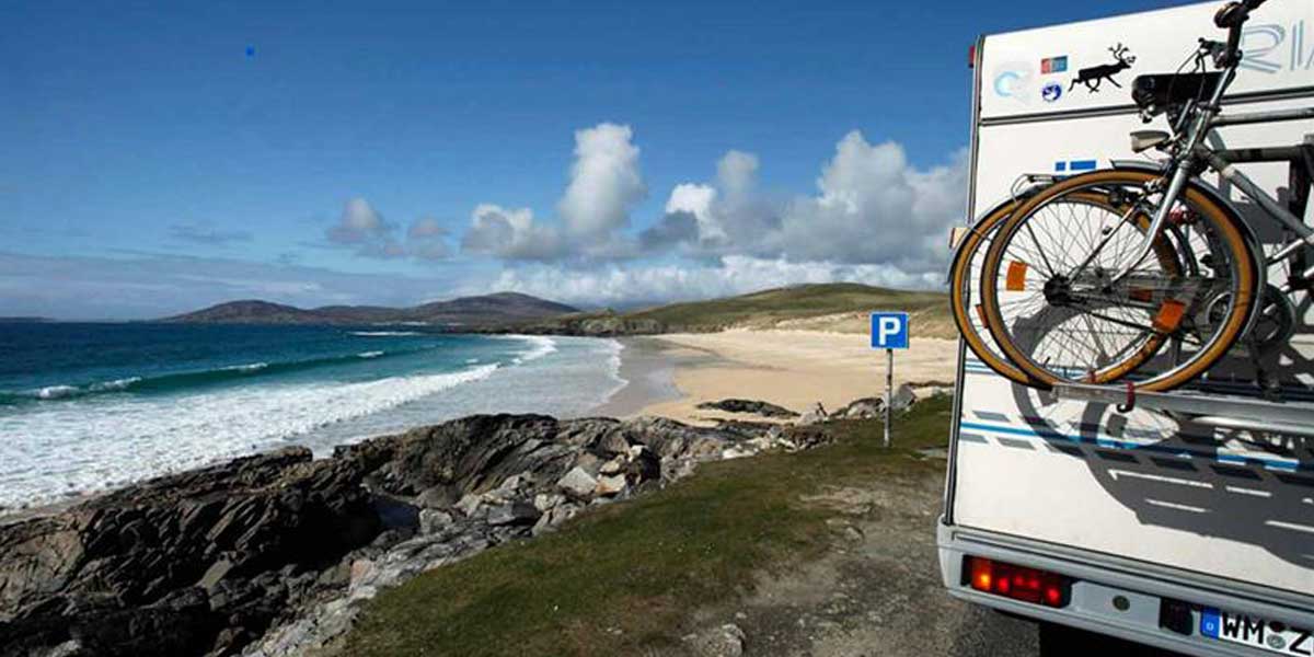 Campervan with bikes attached in Scotland