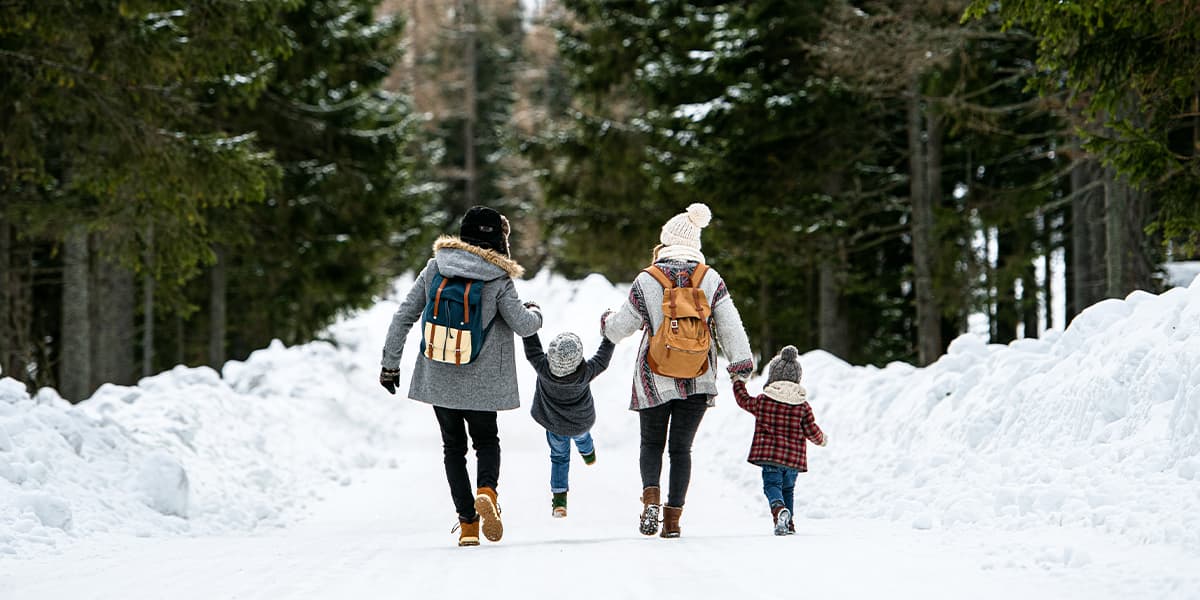Family taking a walk in the snow