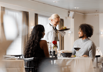 Couple enjoying a meal HERO