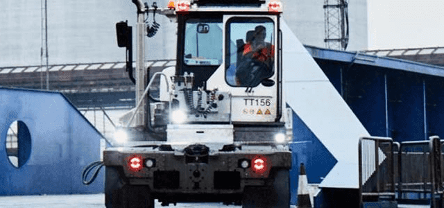 Loader driving across the deck of a DFDS vessel